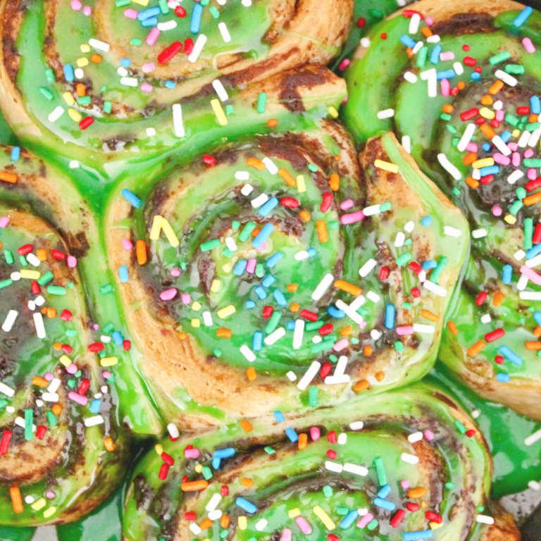 Over the Rainbow Sprinkle Cinnamon Rolls with Green Icing | Easy St. Patrick’s Day Breakfast Ideas