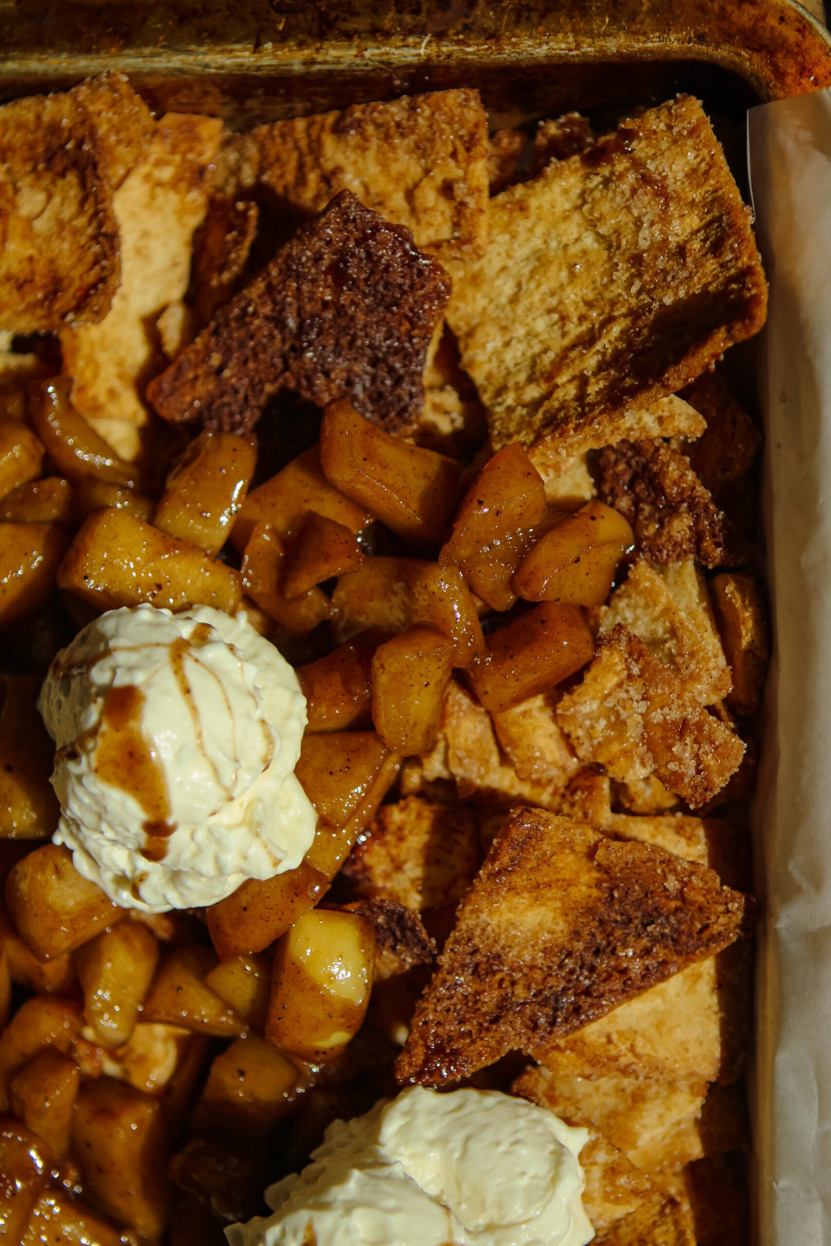 sheet pan cinnamon apple nachos topped with whipped cream cheese dip