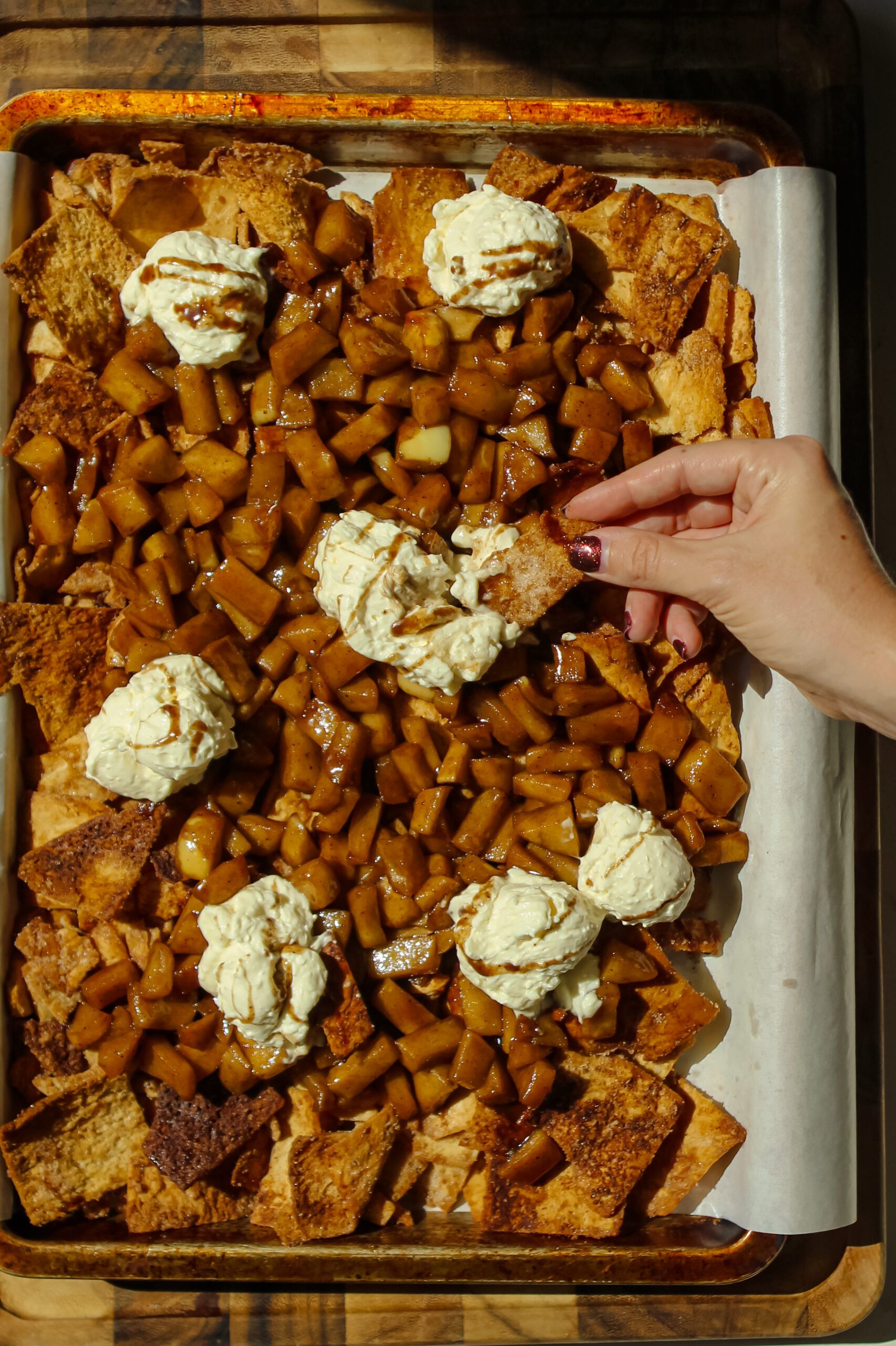 sheet pan cinnamon apple nachos topped with whipped cream cheese dip