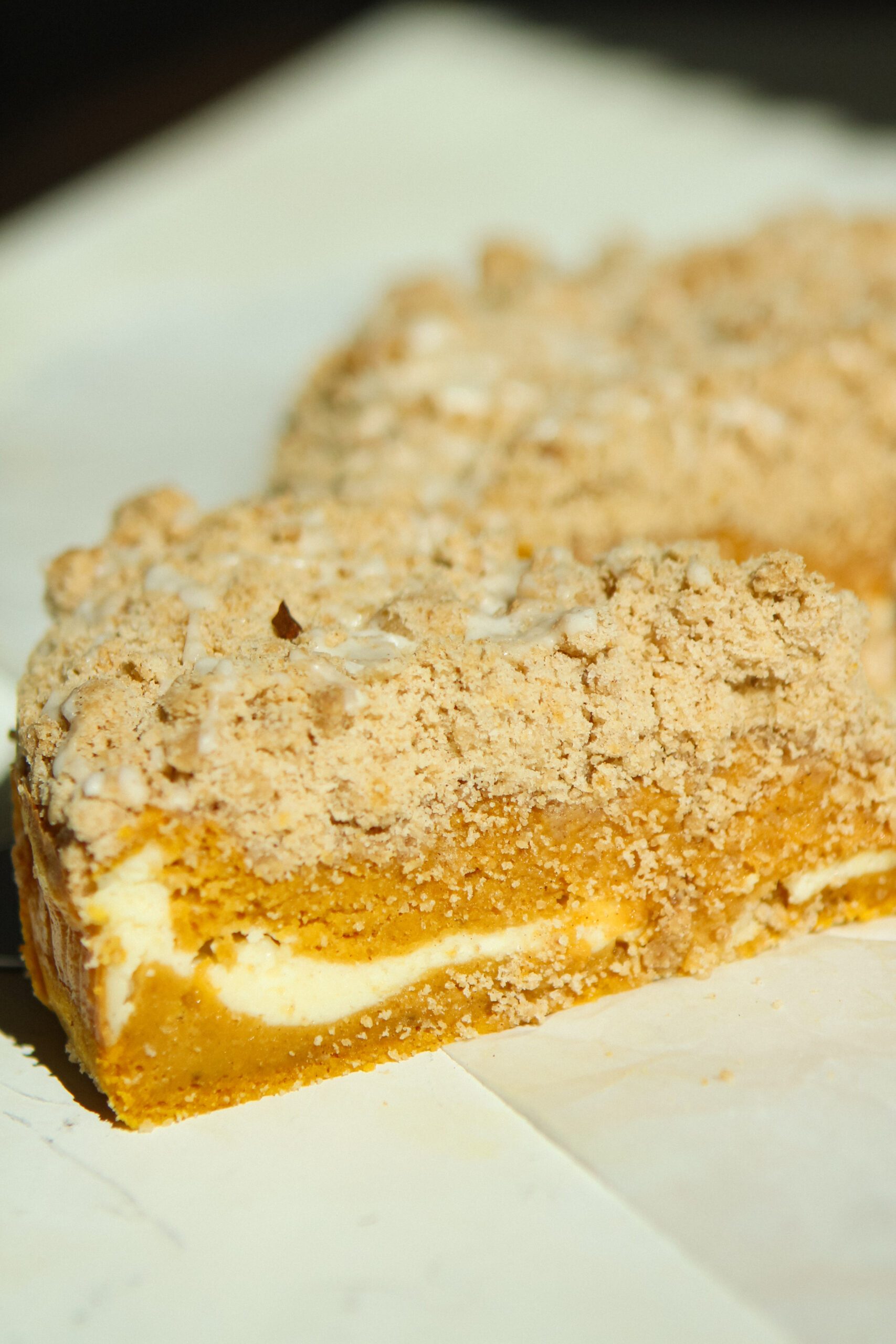 slice of pumpkin coffee cake with cinnamon streusel topping
