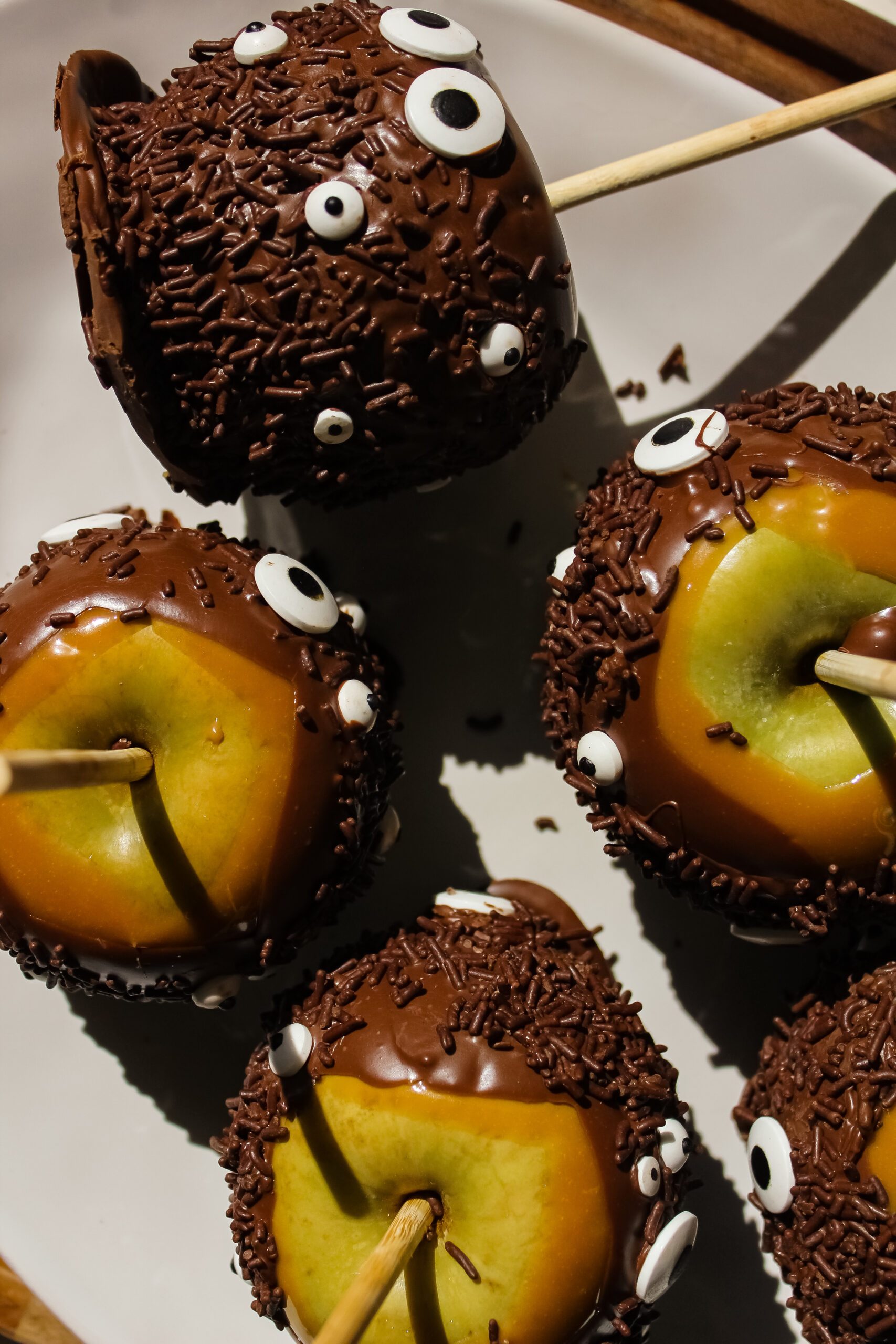 Halloween Monster Caramel Apples Coated in Chocolate
