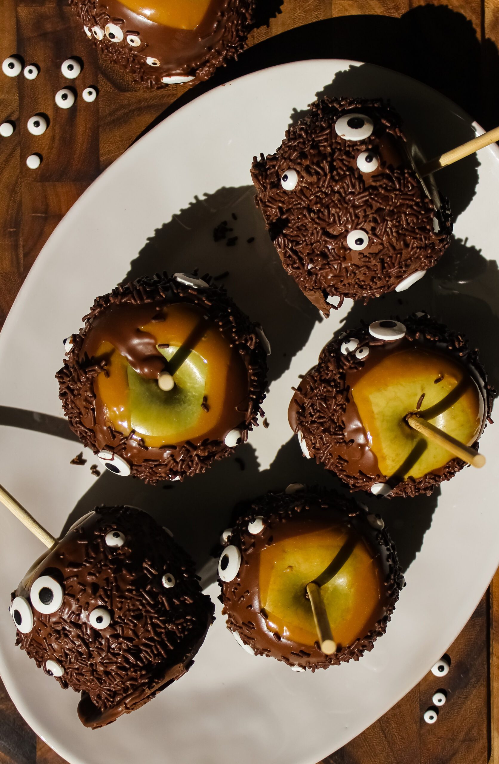 Halloween Monster Caramel Apples Coated in Chocolate
