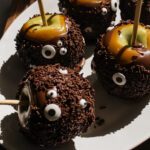 Halloween Monster Caramel Apples Coated in Chocolate