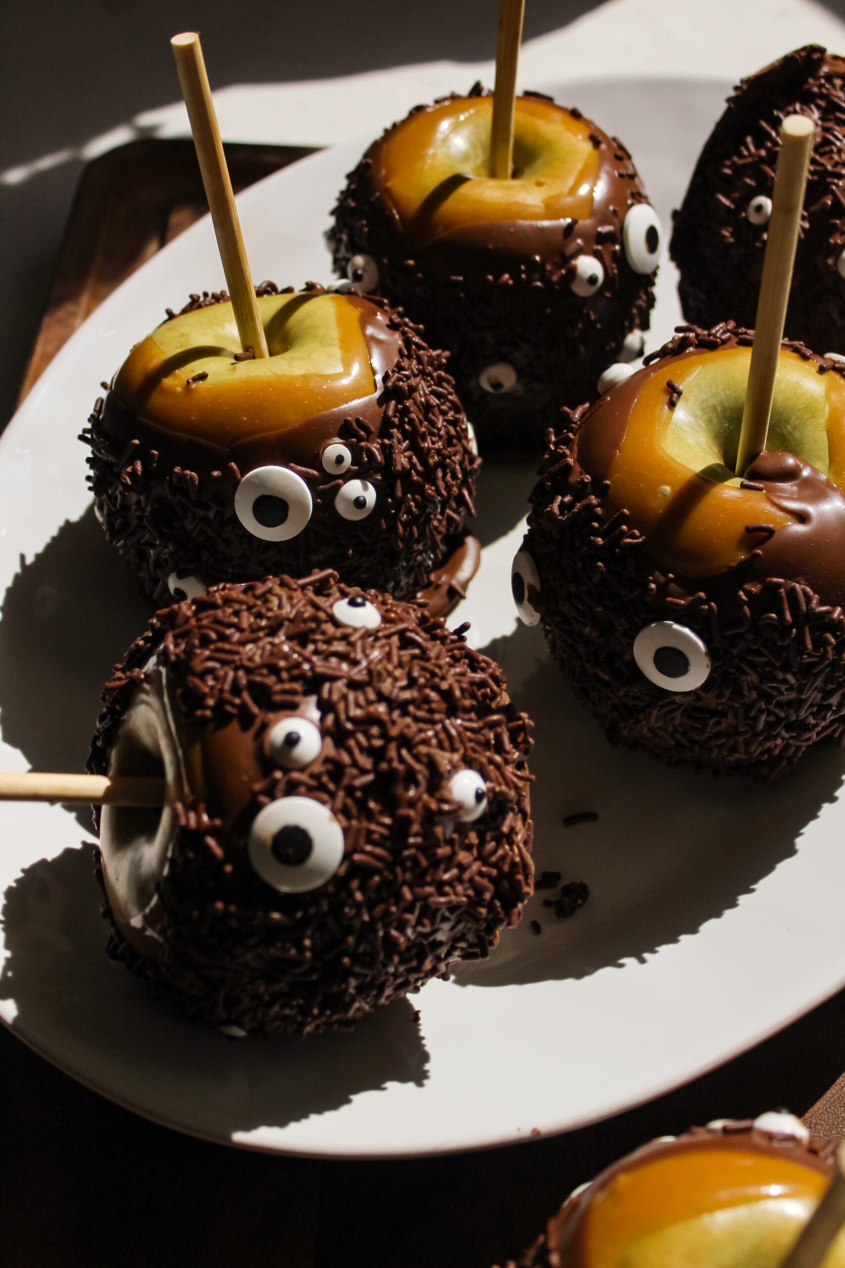 Halloween Monster Caramel Apples Coated in Chocolate
