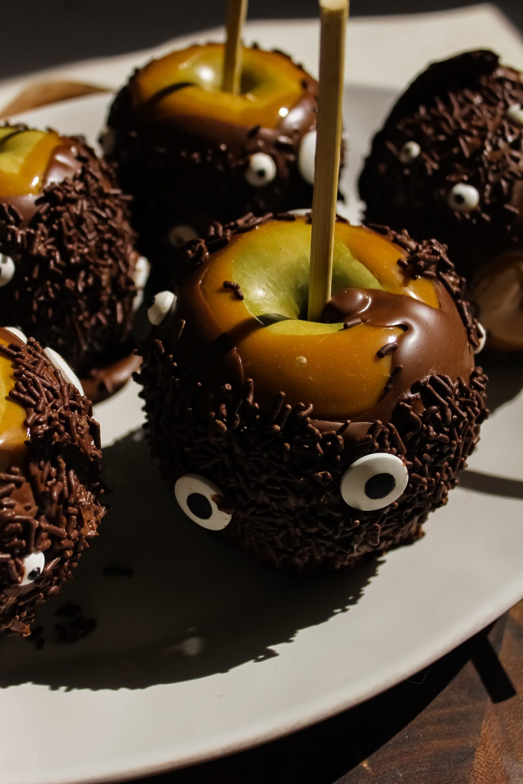 Halloween Monster Caramel Apples Coated in Chocolate
