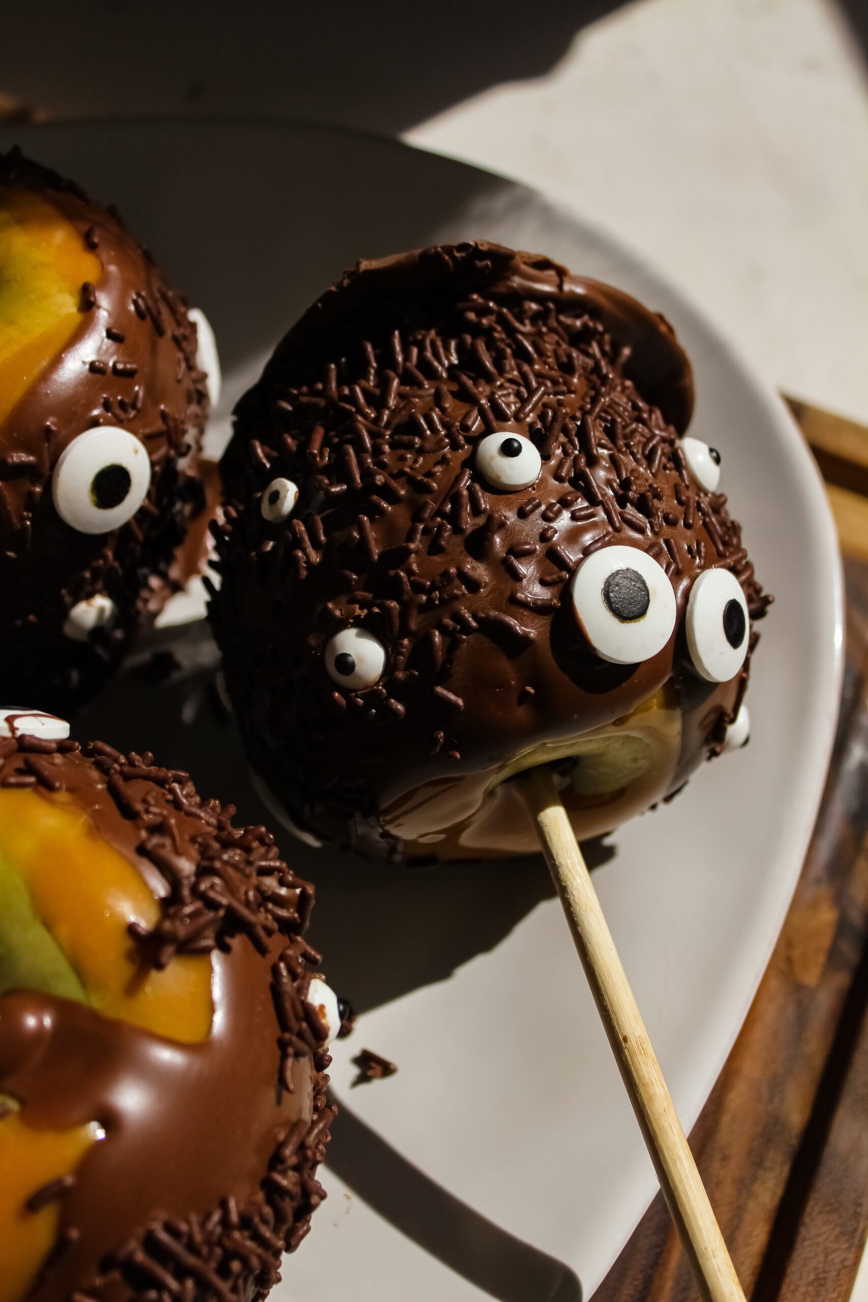 Halloween Monster Caramel Apples Coated in Chocolate
